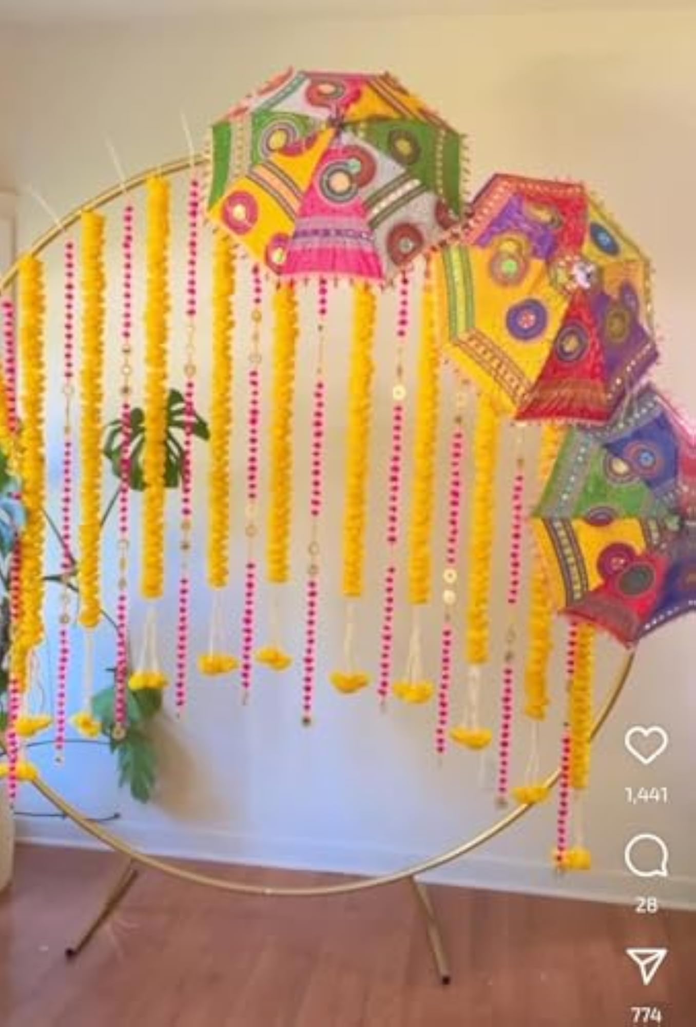 Decorative Ganpati Poojan Setup with Marigold Toran and Umbrellas