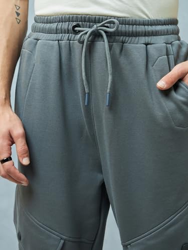Image of Bewakoof Men's Fleece Super Loose Fit Joggers|Bewakoof Heavy Duty 1.0 | Track pants for man | Lower for man | Trouser for men | Baggy trackpants for men | Multipurpose | Mens Lower Activewear | Utility Pockets | Lightweight & Flexible Elastic Waist | Casual Joggers | Loose Fit