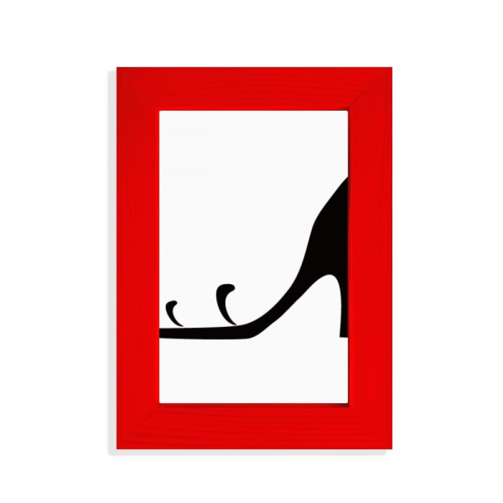 Cadre photo noir talons hauts pour rompre la monotonie d'un mur sans vie
