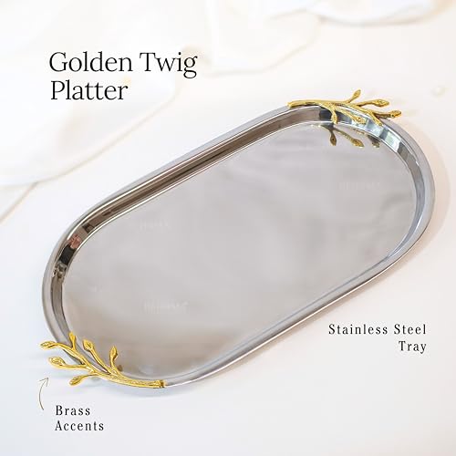 Image of BEHOMA Golden Twig Oval Serving Platter, 13 inch | Oval stainless steel platter with brass leaf handle, 13 inch; elegant serveware for Navratri & Durga Puja.