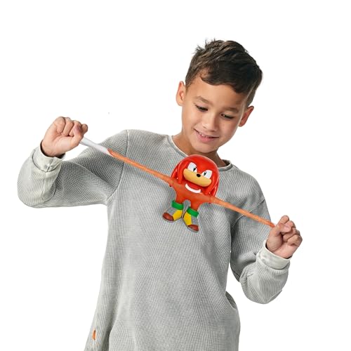 Heroes of Goo Jit Zu Unstoppable Surge Knuckles, Powered Up with Glow Surge Giving Him Glow-in-The-Dark Powers, Scrunchy, Stretchy Filling, Stretch Him Up to 3 Times His Size