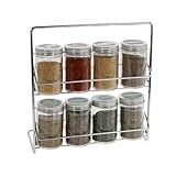 Cet ensemble de pots à épices comprend 8 bouteilles en verre avec couvercle en aluminium, dans un support métallique de 23 x 24 cm.