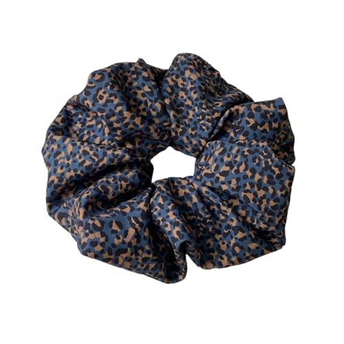 Chouchou cheveux léopard en tissu soyeux avec finitions haut de gamme