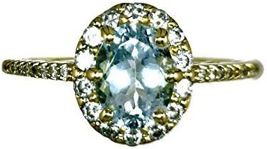 18 K Yellow Gold Aquamarine Halo Ring Oval Stone 0.69 CT and Diamonds 0.46 CT