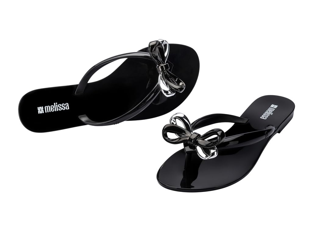 Melissa Harmonic Eclipse - Sandali da donna alla moda, eleganti infradito con fiocco metallico, in PVC leggero, design flessibile, sandali estivi da donna, piatti e flessibili