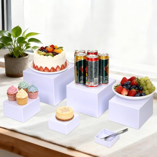 Elevadores de alimentos acrílicos para una mesa de buffet impecable 4