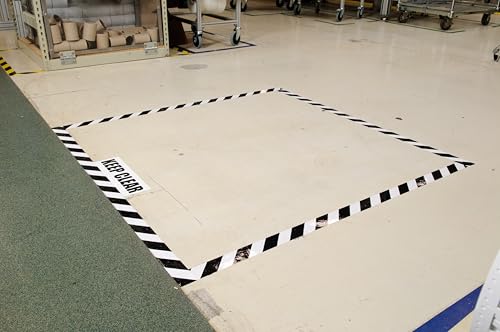 Image of Brady ToughStripe Nonabrasive Diagonal Stripes Floor Marking Tape, 100' Length, 2 inch Width, Black on White (Pack of 1 Roll) - 104319 | Nonabrasive black-and-white diagonal tape measures 2 in x 100 ft for marking aisles, hazards, equipment, and boundaries.