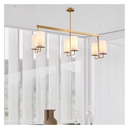 Chandelier en cuivre et son abat-jour en tissu pour illuminer votre salle à manger