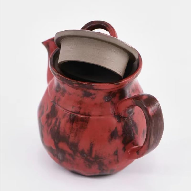 Tetera de cerámica tradicional para preparar té en la cocina 6