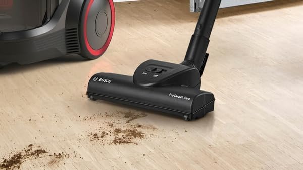 Close-up of the floor nozzle cleaning dirt on a wooden floor