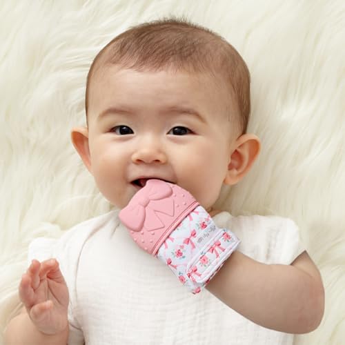 Image of Itzy Ritzy Silicone Teething Mitt - Soothing Infant Teething Mitten with Adjustable Strap, Crinkle Sound & Textured Silicone to Soothe Sore & Swollen Gums - for Ages 3 Months & Up (Bow)