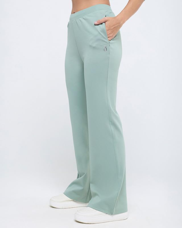 Image of HUNNIT Essential Flare Pants for Women with Zip Pockets | Mid Waist Solid Cotton Tapered Flare Pants | Bootcut Flared Trousers with Wide Elastic Waistband | Relaxed Fit Flared Trouser