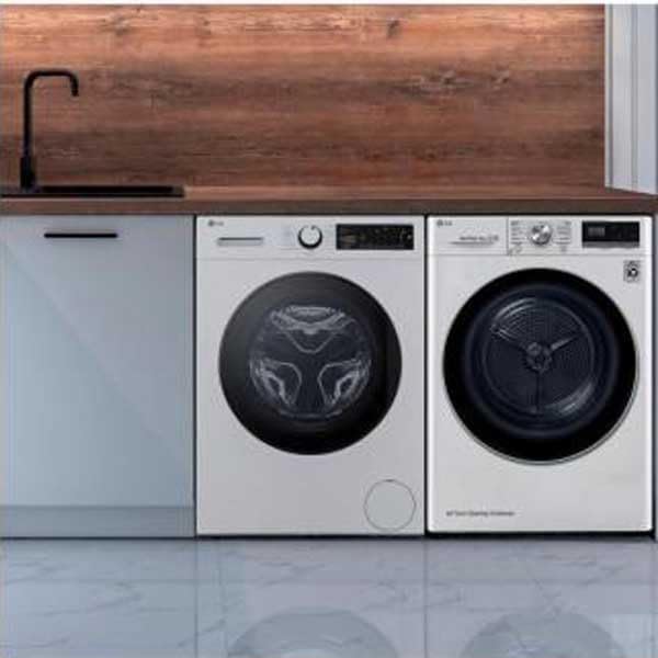 LG washing machine installed next to a dryer under a counter