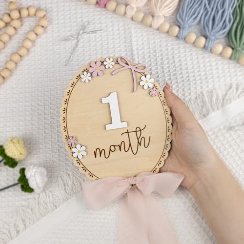 Image of TTMerriwood Baby Monthly Milestone Wooden Sign with Numbers, Natural Wood Milestone Board for Newborn Monthly Growth Photos, Cute 3D Flowers Photo Prop for Baby Milestone Memories (Pink Ribbon)