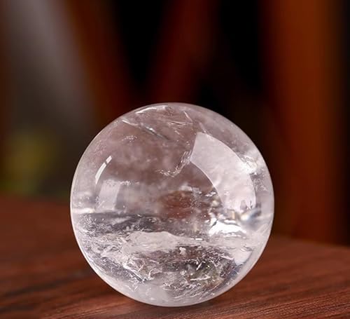 Sphère en cristal de quartz de haute pureté avec support en bois noble