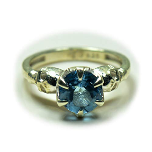 Bague en topaze bleue naturelle et argent massif style griffe haute joaillerie