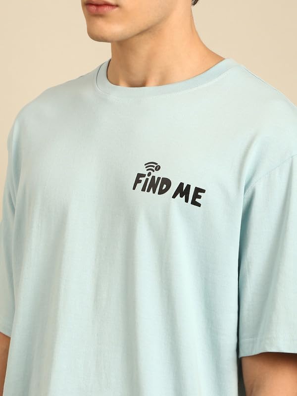 Close-up of the 'FIND ME' typography print on the white t-shirt.
