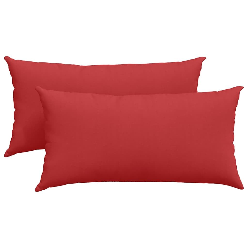 Coussins de canapé rouges au tissu lisse et finitions haut de gamme