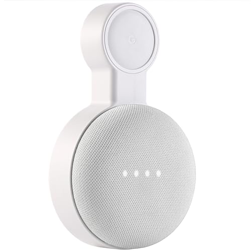 Google Home Mini smart speaker mounted on a wall, featuring a sleek white design and illuminated indicator lights.