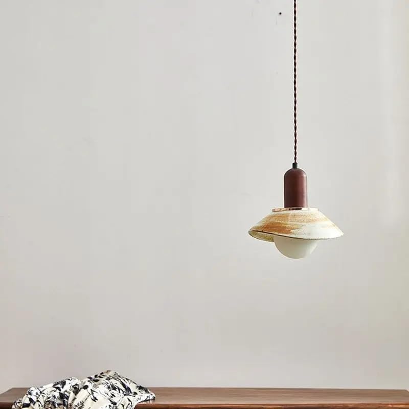 Lumière suspendue en céramique pour éclairer un chevet ou une table de salon