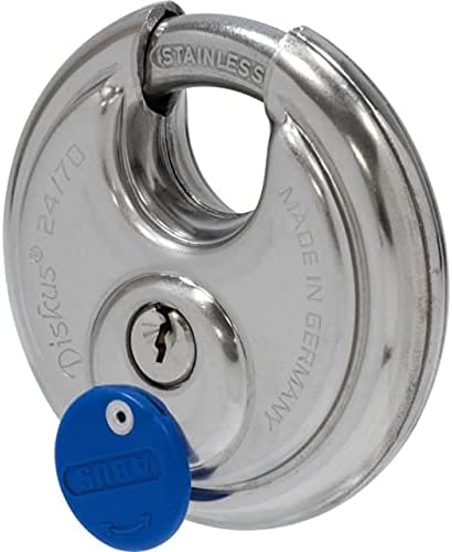 ABUS 24IB/70 RK M1 padlock with a key inserted into the keyhole, ready for unlocking.