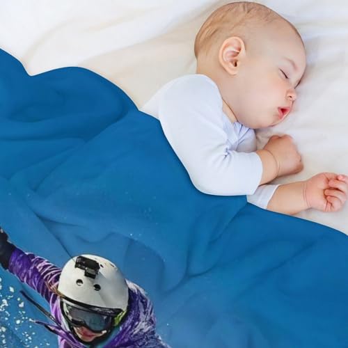 Couverture snowboard en polaire pour soirée cocooning sur canapé