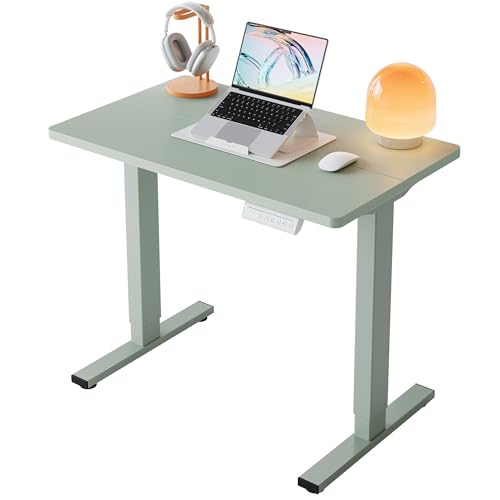 Image of HUANUO 32x19 Inch Small Electric Standing Desk, Adjustable, Sage Green | Compact Home Office Desk, 176lbs heavy duty lifting with 4 height presets. M8 screw holes ready for DIY mobile wheels