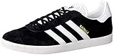 Cuenta con suela de caucho adidas Gazelle, Zapatillas de deporte Unisex Adulto, Varios colores (Core Black/White/Gold Metalic), 44 EU