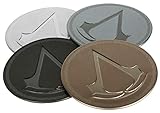Cuatro posavasos de metal con base de corcho