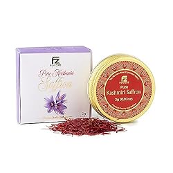 Saffron in a gold and red metal container with purple flowers
