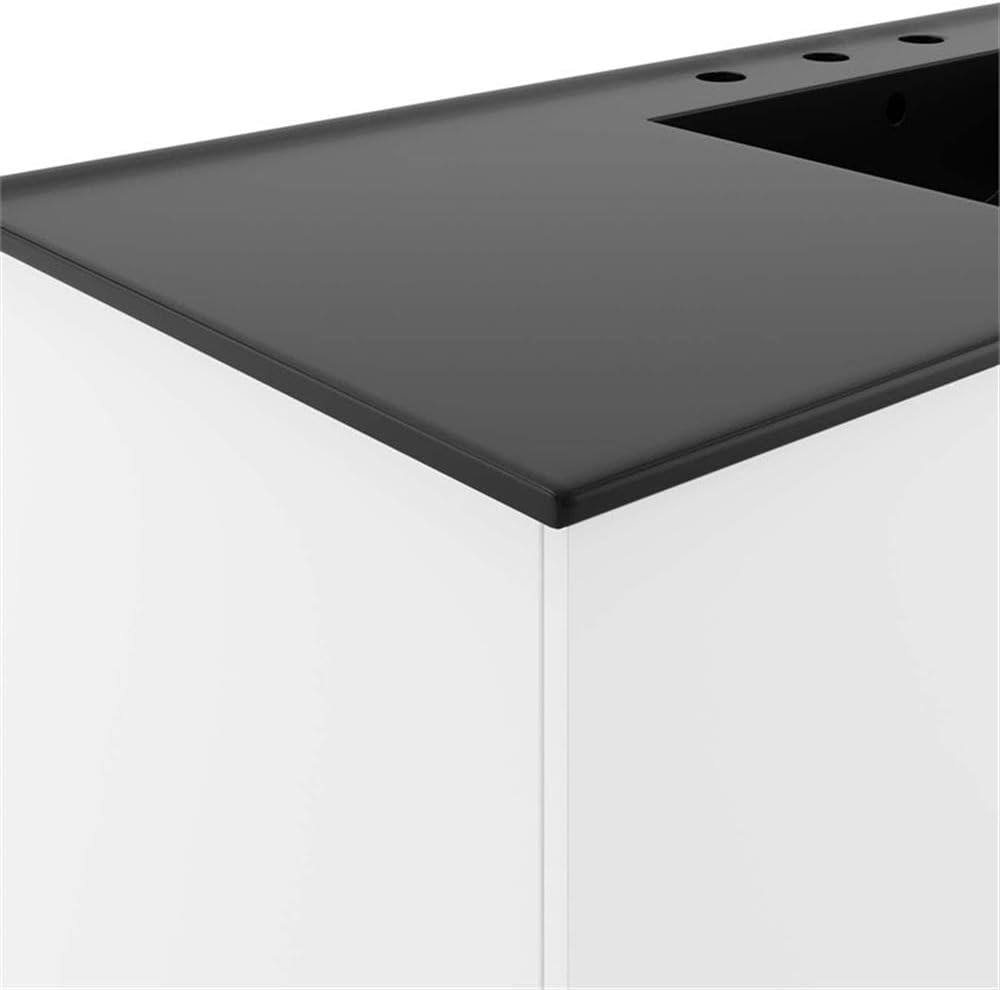 Primer pla view of the black integrated countertop and the white cabinet edge of the Modway Vitality vanity.