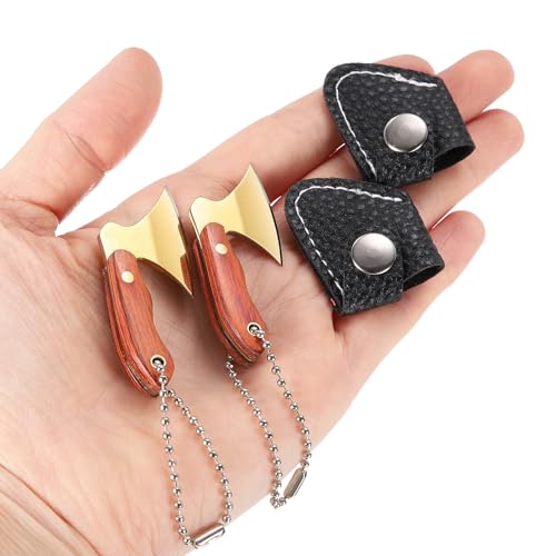 Tiny keychain knives shaped like a hatchet and a butcher cleaver — miniature culinary weapons that are absurdly charming and make an instant double-take gift.