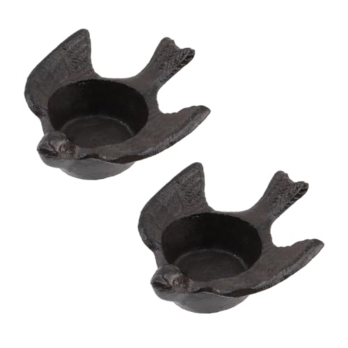 Bougeoirs oiseaux en fer noir pour illuminer une table basse rustique