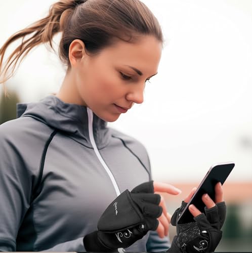 Woman wearing black running gloves while checking a smartphone outdoors