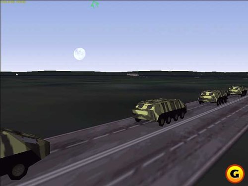 Rear view of an F/A-18 Super Hornet flying over a mountainous landscape