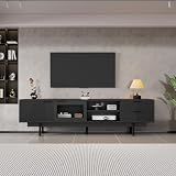 Almacenaje de 2 Puertas con Vidrio Templado y 2 Cajones Esta mesa tv salon ofrece una organizacion versatil mediante dos armarios y dos cajones espaciosos para guardar accesorios multimedia Su estructura de mueble de salon incluye una puerta de cristal transparente ideal para exhibir colecciones de discos o figuras manteniendo el orden y la elegancia en su estancia principal de forma segura