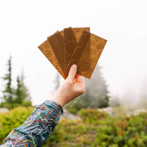 Image of GEAR AID Tenacious Tape Repair Patches - Peel-and-Stick Nylon Gear Patches for Jackets, Tents, Sleeping Bags, Backpacks, and Outdoor Gear - Fix Rips, Tears, and Holes, 19 Various Sizes, Coyote
