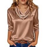 Dispose d'un col en V polyvalent et de manches longues fluides, parfait pour créer un look chic et poli qui passe parfaitement de la journée au bureau aux occasions en soirée.