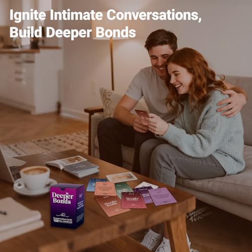 Two people using colorful conversation cards while sitting together on a sofa.