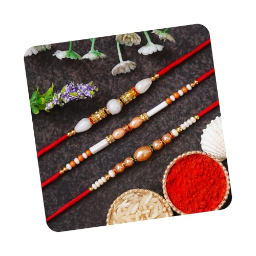 Image of eCraftIndia Red & Golden Set of 3 Trishul with Damru, Lord Ganesha, & Lord Krishna Playing Flute Religious Rakhis with Roli Chawal Pack