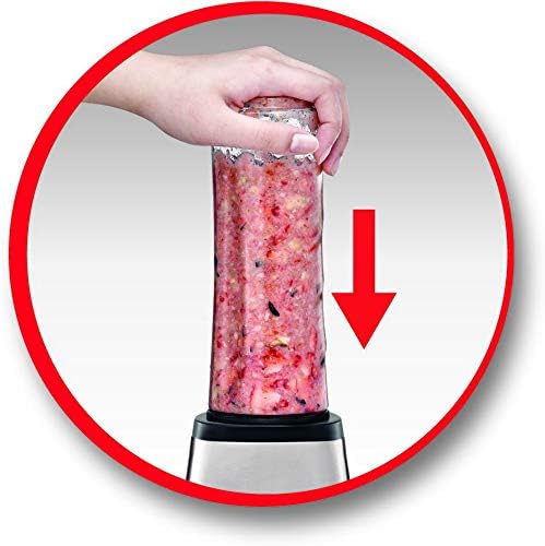 Hand pressing down on the blending bottle to activate the blender
