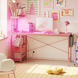 Bestier Gaming Desk with Power Outlets, 61 Inch Large Led Gamer Desk with 4 Tiers Reversible Shelves, PC Gaming Table with Headset Hook & Side Storage Bag for Bedroom (Pink 3D Carbon Fiber)