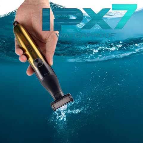 Hand holding VGR V-339 trimmer partially submerged in water, demonstrating its waterproof capability