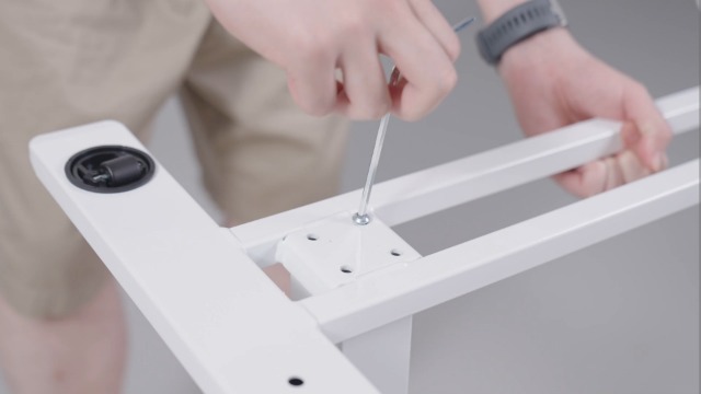 Diagram of desk parts including base, tabletop, lifting column, crossbeam, wrench spring, Phillips screwdriver, and cup holder.