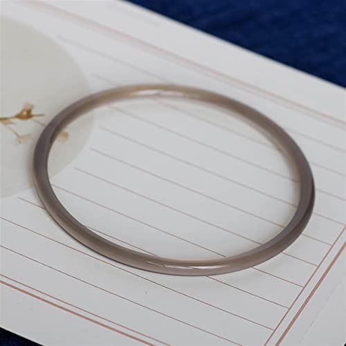 Bracelet en jade naturel et argent sculpté main au design intemporel