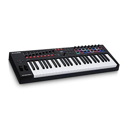 M-Audio Oxygen Pro 49 - teclado controlador MIDI USB con 49 teclas, beat pads, perillas asignables de MIDI, botones y faders, más pack de sonidos de Native Instruments (integración de NKS)