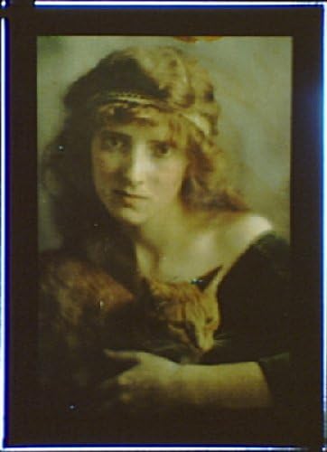 1906 photo Woman wearing a headband holding Buzzer the cat historic black & white
