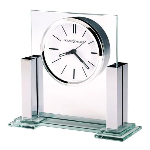 Howard Miller Metropolitan Tabletop Clock – Glass & Metal Alarm Clock with Polished Silver Columns Battery Operated Quartz Movement Modern Desk Décor & Luminous Hands for Office & Home Decor