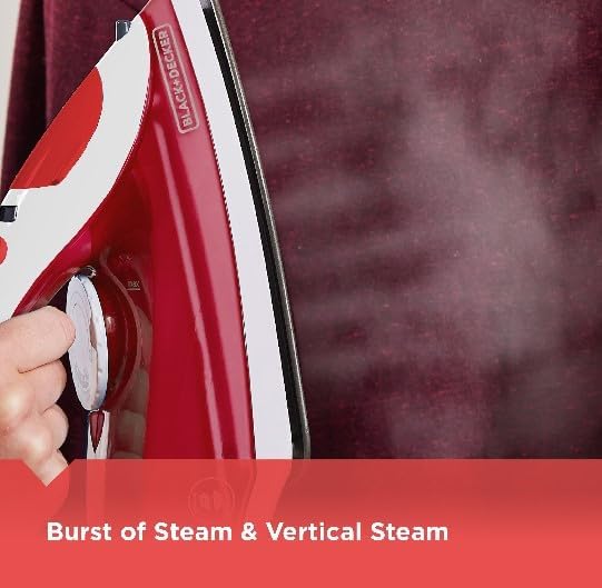 Hand pressing the burst of steam button on the iron