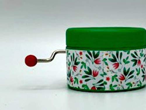 Caja de música color verde con un estampado hojas y la canción de Elvis de I can`t help falling in love